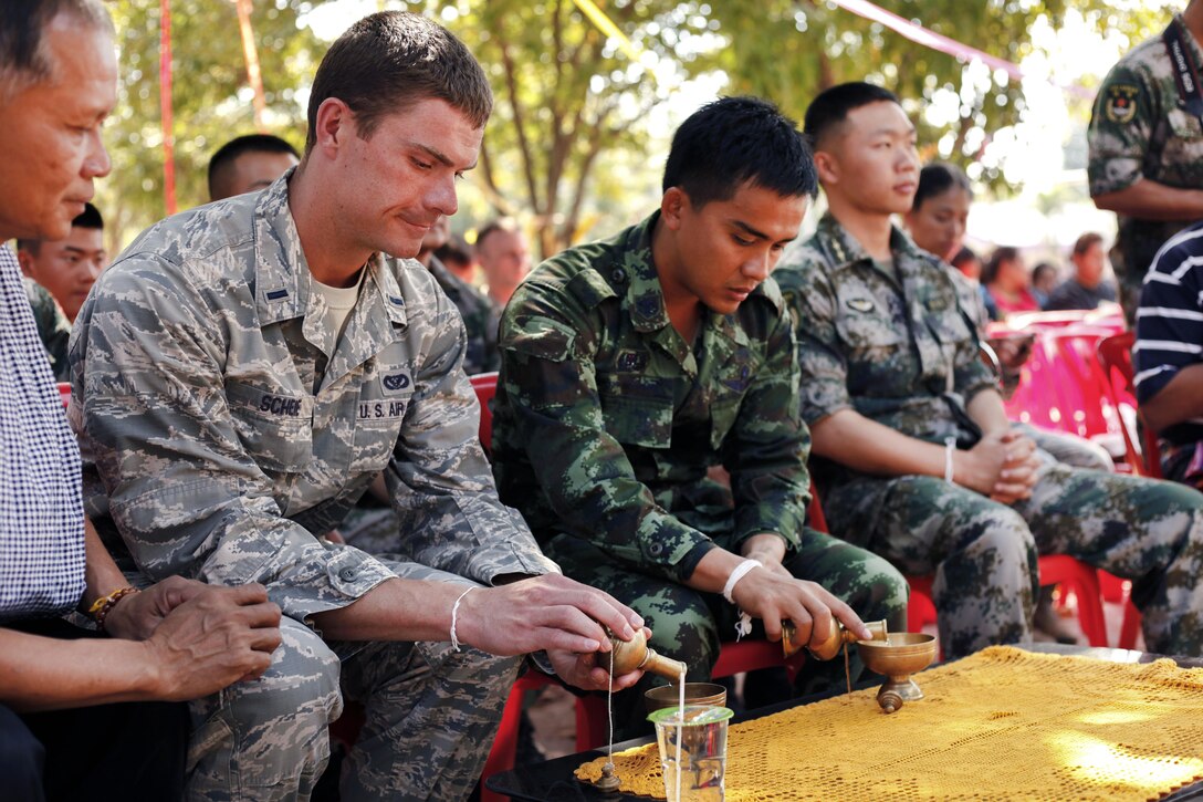 Air Force 1st Lt. Scheie, second from left, along with other service members from the U.S., Thailand, India and China attend an assembly during exercise Cobra Gold in Ban Non Lueam, Thailand, Feb. 17, 2017. Cobra Gold focuses on humanitarian civic action, community engagement and medical training. Marine Corps photo by Lance Cpl. Maximiliano Rosas