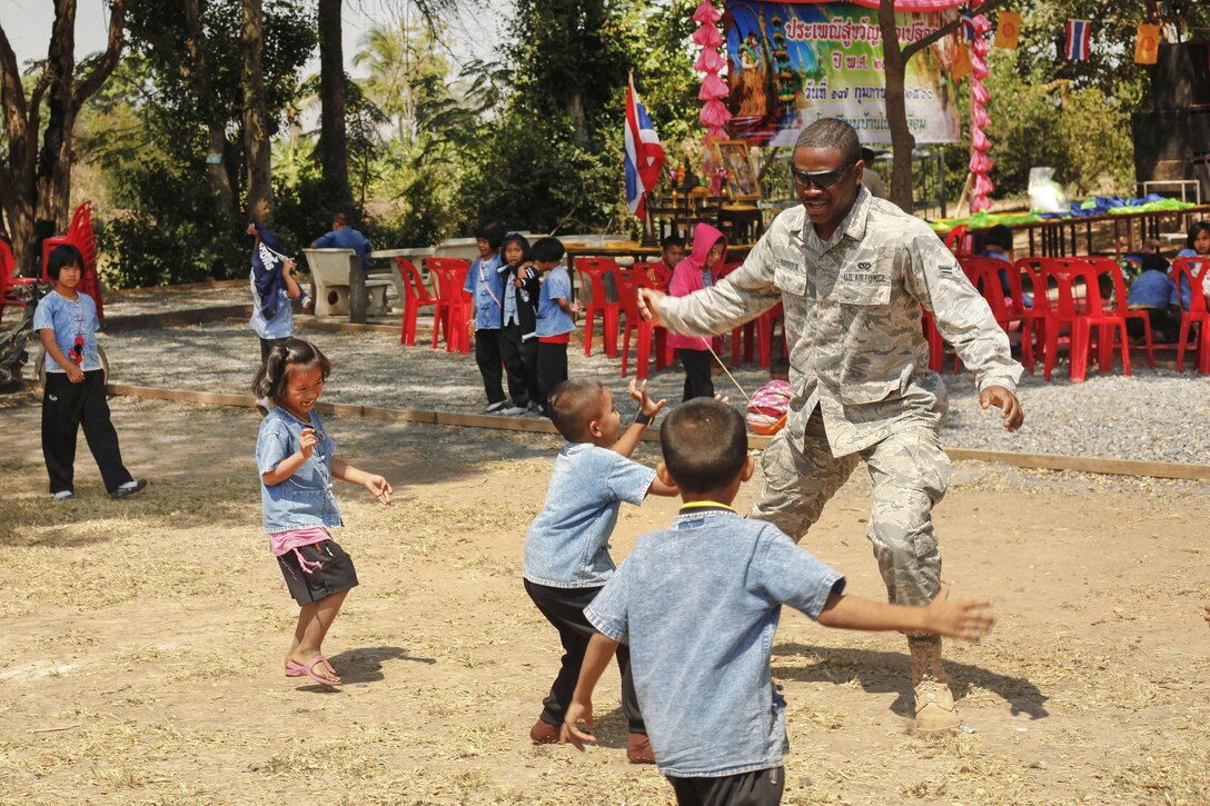 Airman 1st Class Romello Barbour plays with children during exercise Cobra Gold in Ban Non Lueam, Thailand, Feb. 17, 2017. Barbour is an electrician assigned to the 35th Civil Engineer Squadron. Marine Corps photo by Lance Cpl. Maximiliano Rosas