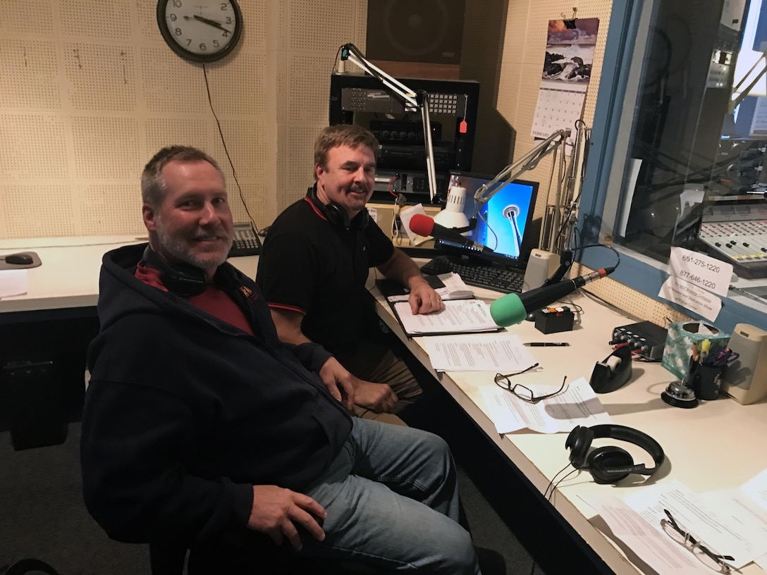 Brian Gray, left, lockmaster at Lock and Dam 2 in Hastings, Minn., gets ready for an interview with John Tetzlaff at KLBB-AM to talk about how recreational boaters can be safe around lock and dams and how to share the road with commercial tows.