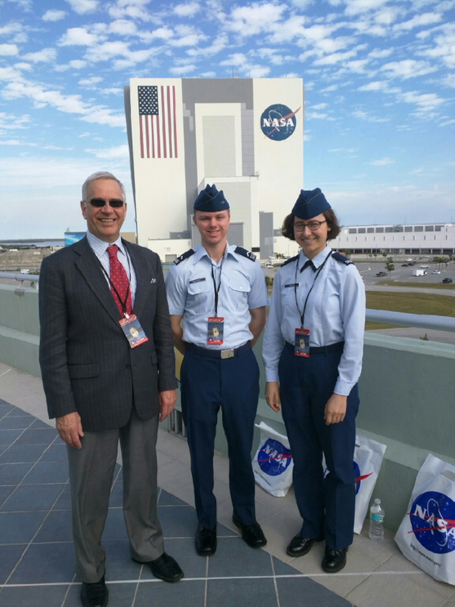 Dr. Geoff McHarg (left), director of the Space Physics and Atmospheric Research Center at the U.S. Air Force Academy, stands with Cadet 3rd Class Nick McDaniel (middle) and Cadet 4th Class Sequoia Chun, in front of the Vehicle Assembly Building at Cape Canaveral, Florida, Feb. 19, 2017. The trio attended the Space-X CRS-10 launch taking the latest Academy space experiment to the International Space station. (U.S. Air Force photo) 

