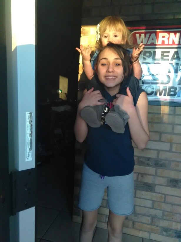 U.S. Air Force Tech. Sgt. Jerrika Stark, 7th Force Support Squadron community services technician, is inspired each day by her family. She has three daughters (Zaida and Evelyn, pictured, and Layla) who she says keep life interesting for her: “They keep me going, and keep every single day exciting from sun-up to sun-down.” (Courtesy photo)