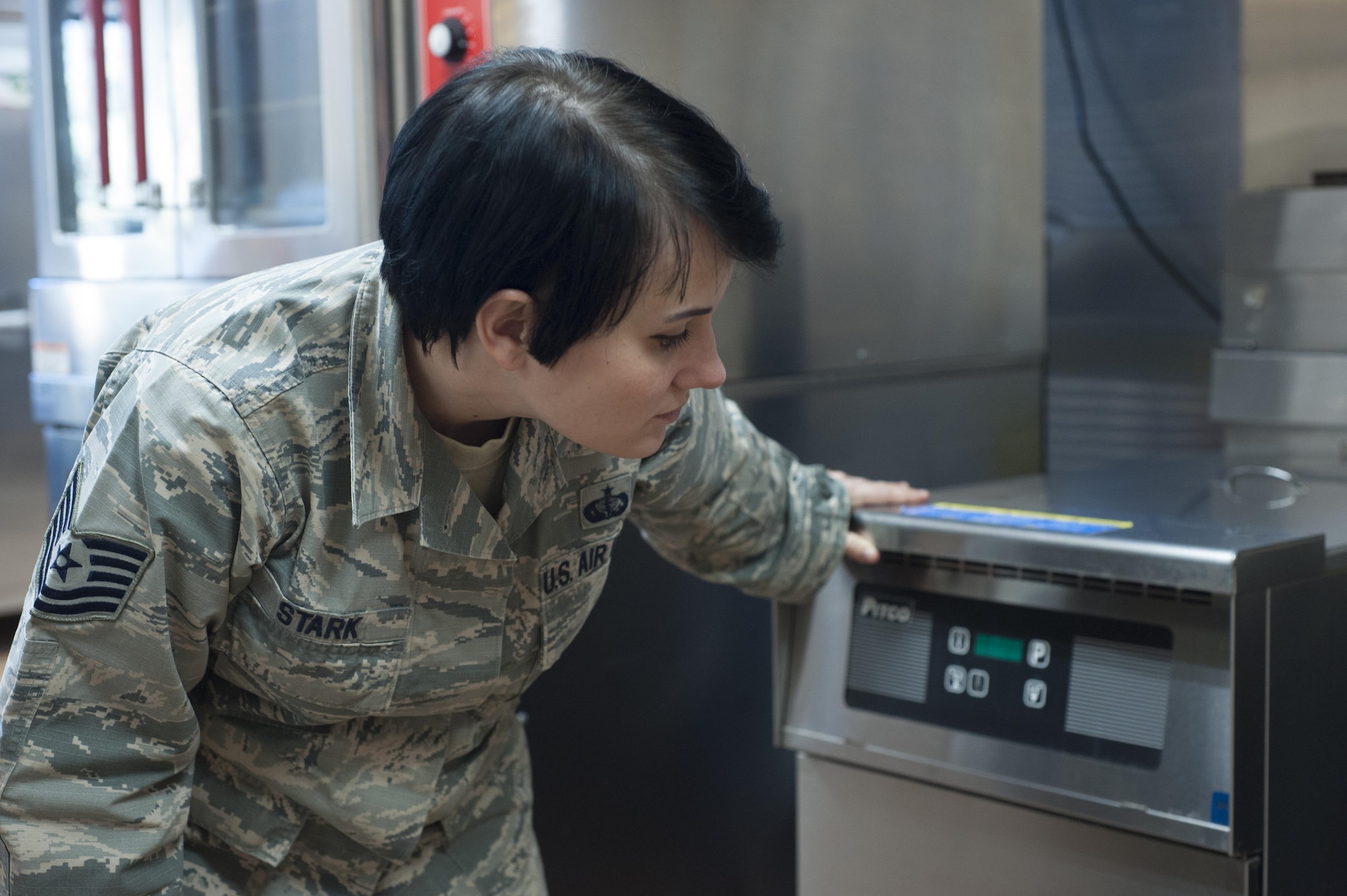 U.S. Air Force Tech. Sgt. Jerrika Stark, left, 7th Force Support Squadron community services technician, examines the equipment of the Legends Café at Dyess Air Force Base, Feb. 17, 2016. With a wealth of food management experience from being the Longhorn Dining Facility manager, Stark is assigned to the Legends Café to help pass on her knowledge so it can expand successfully into a full-fledged restaurant in the future. (U.S. Air Force photo by Rebecca Van Syoc)