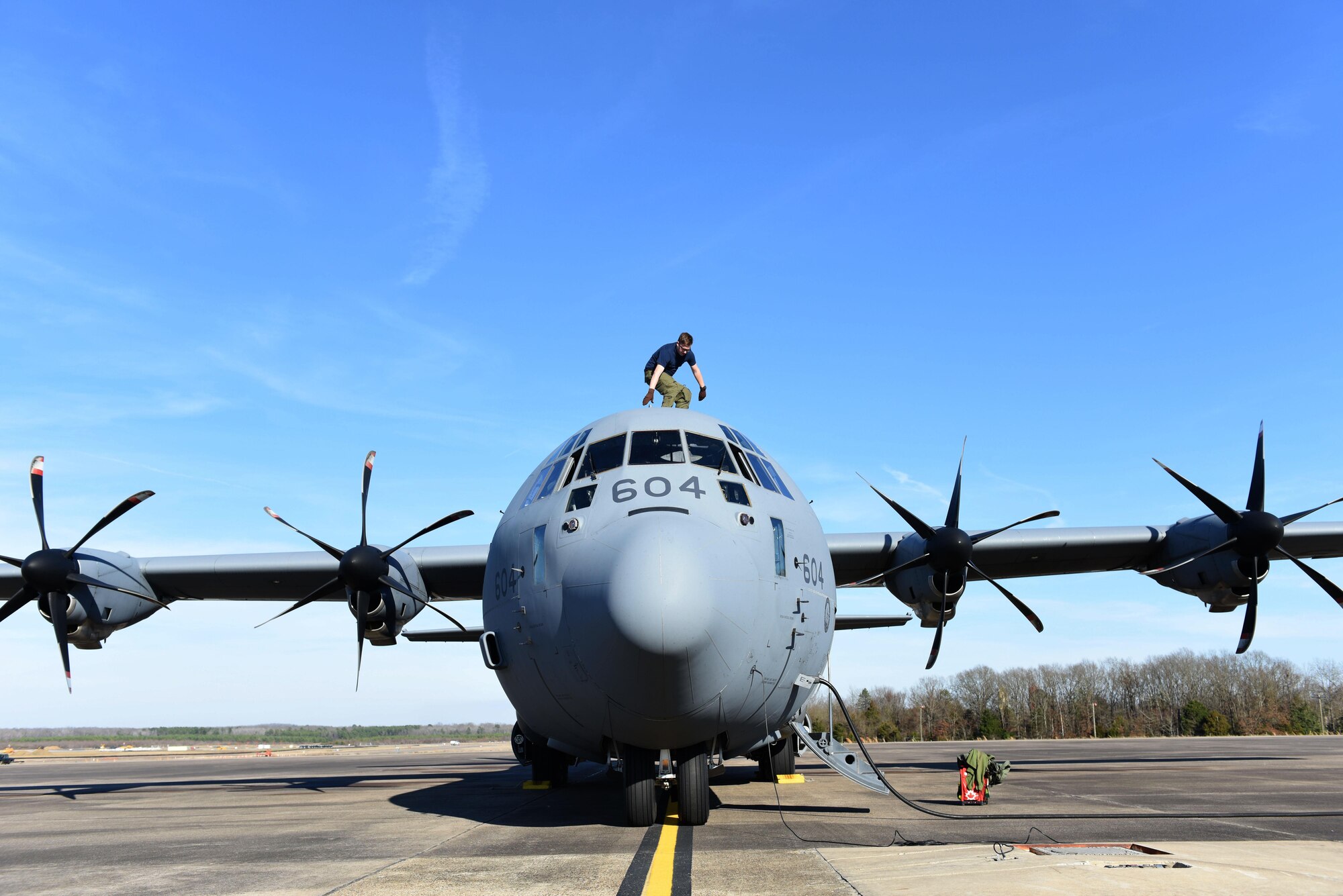 Royal Canadian Air Force Cpl. Julien Simard, 436 Transport Squadron loadmaster, enters a C-130J during a pre-flight check Feb. 10, 2017, at Little Rock Air Force Base, Ark. Two aircraft and approximately 70 personnel from the RCAF came to Little Rock AFB to participate in Green Flag Little Rock 17-04. (U.S. Air Force photo by Senior Airman Mercedes Taylor)