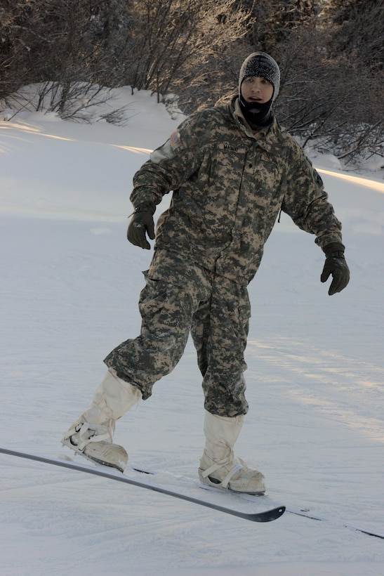 An instructor at the Northern Warfare Training Center in Alaska test-wears an Arctic camouflaged cold-weather uniform, Feb. 12, 2017. DoD photo by David Vergun