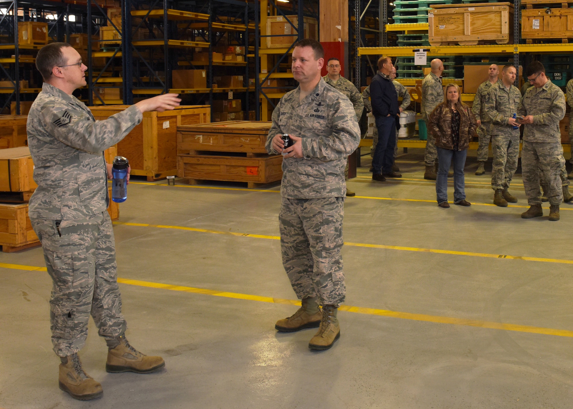 Staff Sgt. Jeremy Adams, 341st Logistics Readiness Squadron warehouse facility manager, provides a tour to Lt. Col. Fred Garcia, 341st Mission Support Group deputy commander, Feb. 21, 2017, at Malmstrom Air Force Base, Mont. The 341st LRS officially recognized the warehouse as a centralized location for cargo operations and defense travel management operations with a ribbon-cutting ceremony.  (U.S. Air Force photo/Jason Heavner)