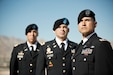 Captain Ricardo Romo, First Lieutenant Daniel Hernandez, and Second Lieutenant Andrés Morales wearing dress blues standing together outside during the day.