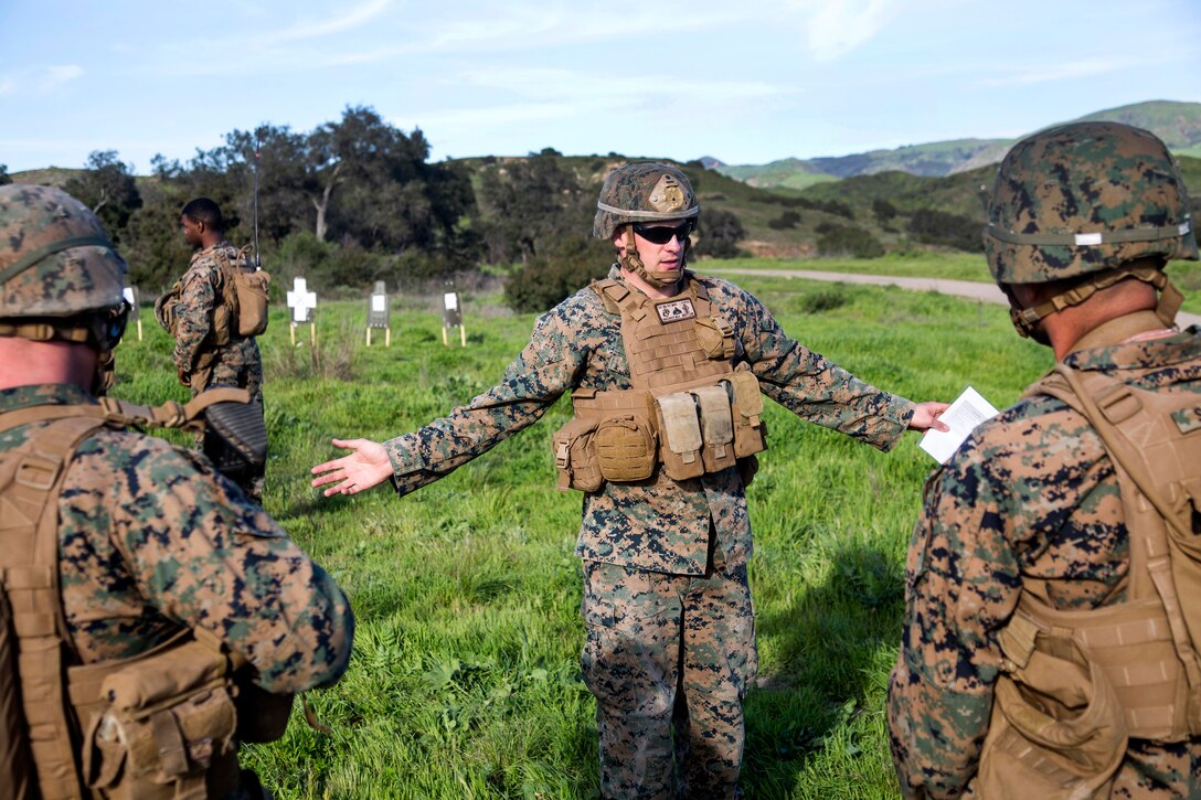 Marine Corps Cpl. Matthew Wagner, center, gives an after-action report to his squad after participating in a live-fire event as part of Exercise Iron Fist at Marine Corps Base Camp Pendleton, Calif., Feb. 13, 2017. Wagner is a squad leader assigned to the 1st Platoon, 1st Battalion, 1st Marine Regiment. Marine Corps photo by Lance Cpl. Tyler Byther