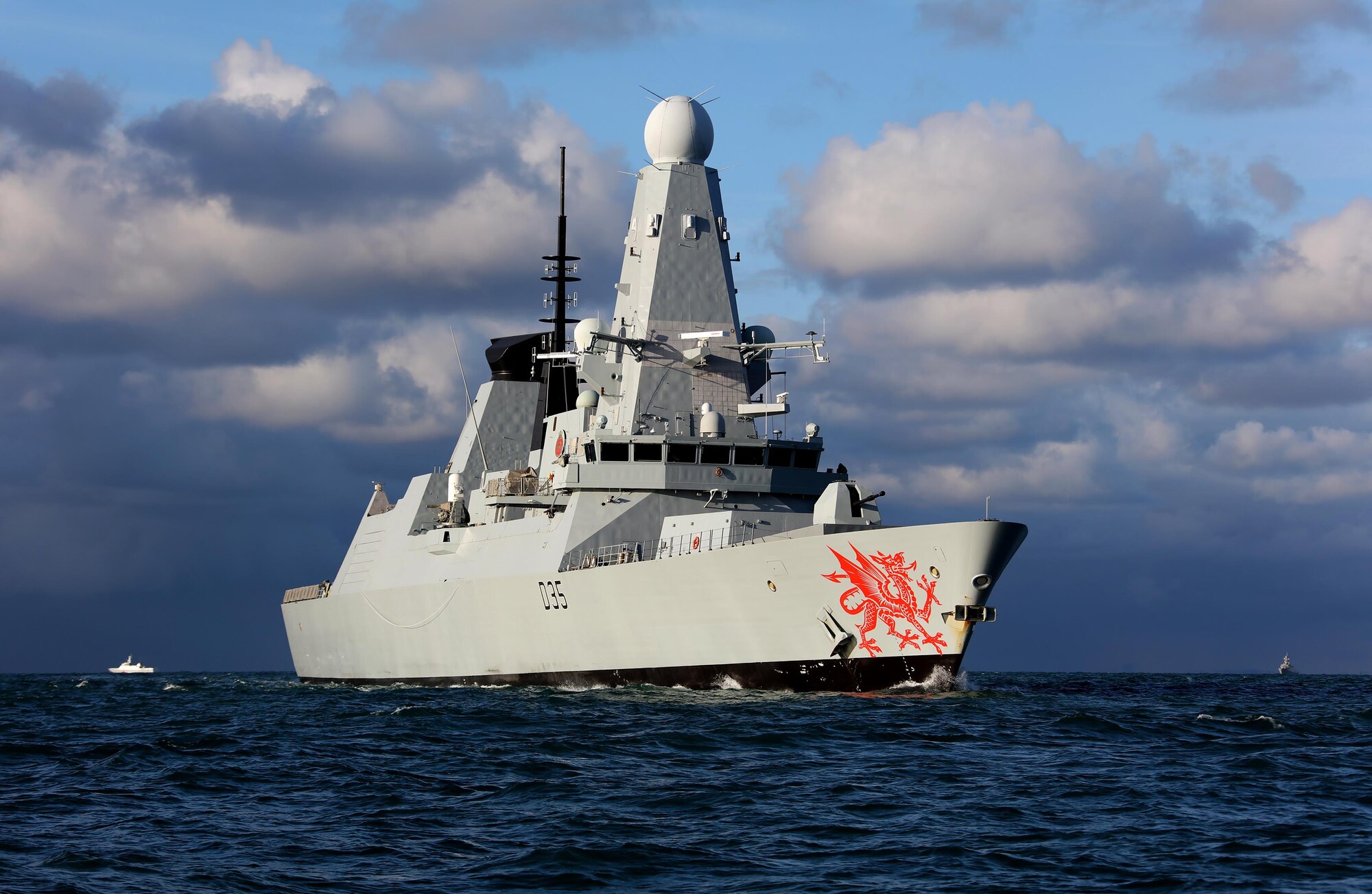 The HMS Dragon, a Royal Navy warship, rescues 14 stricken sailors from damaged British racing yacht Feb. 11, 2017, on the Atlantic Ocean. HMS Dragon was diverted 500 miles away from a routine tasking to provide life-saving assistance to the crew of the 60ft Clyde Challenger racing yacht. (Courtesy photo by Royal Navy)