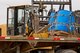Senior Airman Alberto Ocampo, air transportation, 19th Logistics Readiness Squadron, uses a 10K All Terrain Forklift to load a water barrel container delivery system (CDS) onto a tractor trailer at the Blackjack Drop Zone Feb. 11, 2017, near Beebe, Ark. Airmen assigned to the 19th LRS recovered eight airdropped CDSs from the drop zone for return to Little Rock Air Force Base. (U.S. Air Force photo by Master Sgt. Jeff Walston/Released)