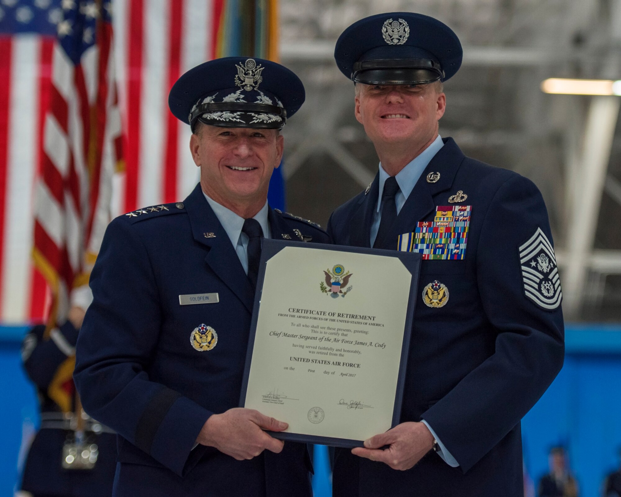 Chief of Staff Gen. David L. Goldfein and Chief Master Sergeant of the Air Force James A. Cody posed for a photograph during the Chief Master Sergeant of the Air Force Retirement and Appointment Ceremony at Joint Base Andrews, Md., Feb. 16, 2017. During the event, Chief Master Sgt. of the Air Force James A. Cody was retired and Chief Master Sgt. Kaleth O. Wright was appointed the 18th Chief Master Sgt. of the Air Force. (U.S. Air Force photo by Airman 1st Class Valentina Lopez)