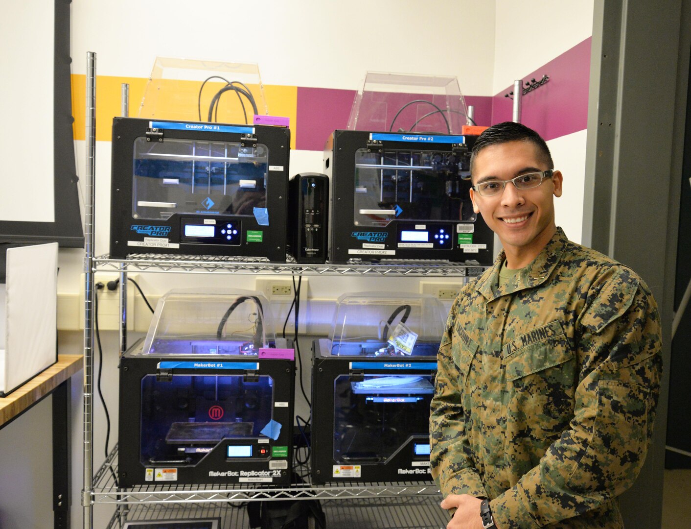 U.S. Marine Corps 2nd Lt. Ben Lacount works on an ammunition rounds counter in the Manufacturing and Knowledge Lab at Naval Surface Warfare Center, Carderock Division in West Bethesda, Md., Dec. 19, 2016. Carderock's Additive Manufacturing Project Office, along with the Corrosion and Coatings Engineering Branch, have partnered to provide support for the Marine Corps Innovation Challenge. 