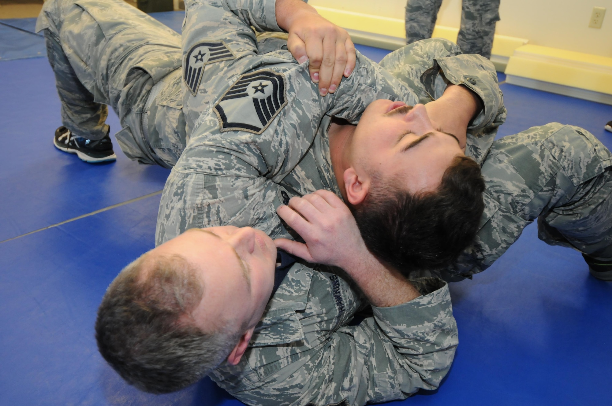 U.S. Air Force Staff Sgt. Cody Broussard, 173rd Security Forces Squadron, works against his assailant Master Sgt. Ross Hawkins, 173rd SFS, in a demonstration of Air Force Security Forces Combatives where an officer works to extract themselves from a choke hold, Jan. 13, 2017 at Kingsley Field in Klamath Falls, Oregon. Combatives training helps security forces members protect themselves in a hand-to-hand situation by using leverage to extract themselves from a bad situation or to quickly subdue an attacker without causing harm. (U.S. Air National Guard photo by Tech. Sgt. Jefferson Thompson)