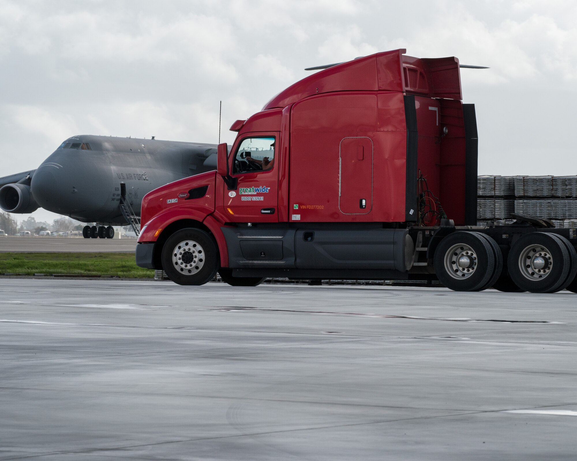 Trucks and personnel from the Federal Emergency Management Agency arrive at Travis Air Force Base, Calif., Feb. 16, 2017. Travis AFB is acting as a staging area for FEMA personnel, providing space for necessary equipment and supplies in case of the Oroville auxiliary spillway failure. (U.S. Air Force photo/Louis Briscese)