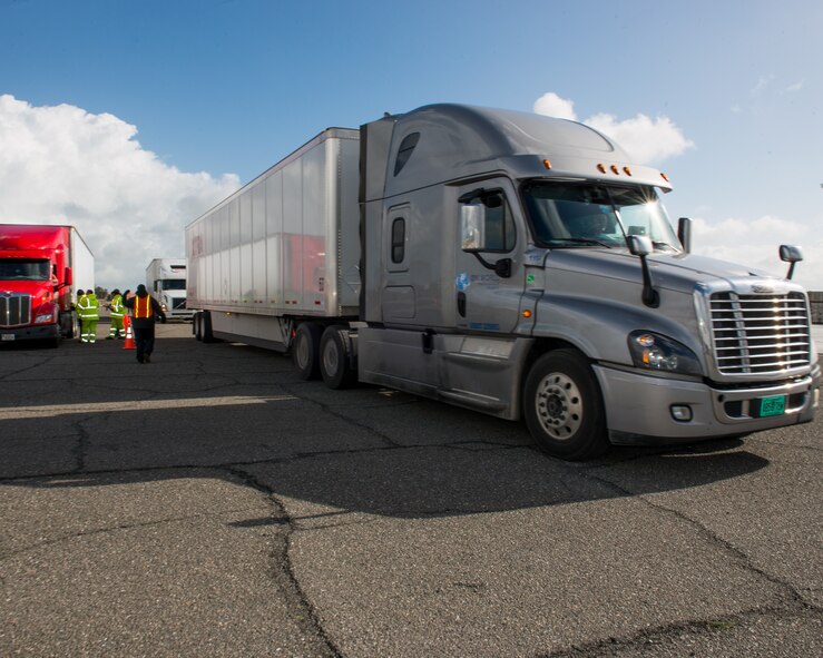 Trucks and personnel from the Federal Emergency Management Agency arrive at Travis Air Force Base, Calif., Feb. 16, 2017. Travis AFB is acting as a staging area for FEMA personnel, providing space for necessary equipment and supplies in case of the Oroville auxiliary spillway failure. (U.S. Air Force photo/Louis Briscese)