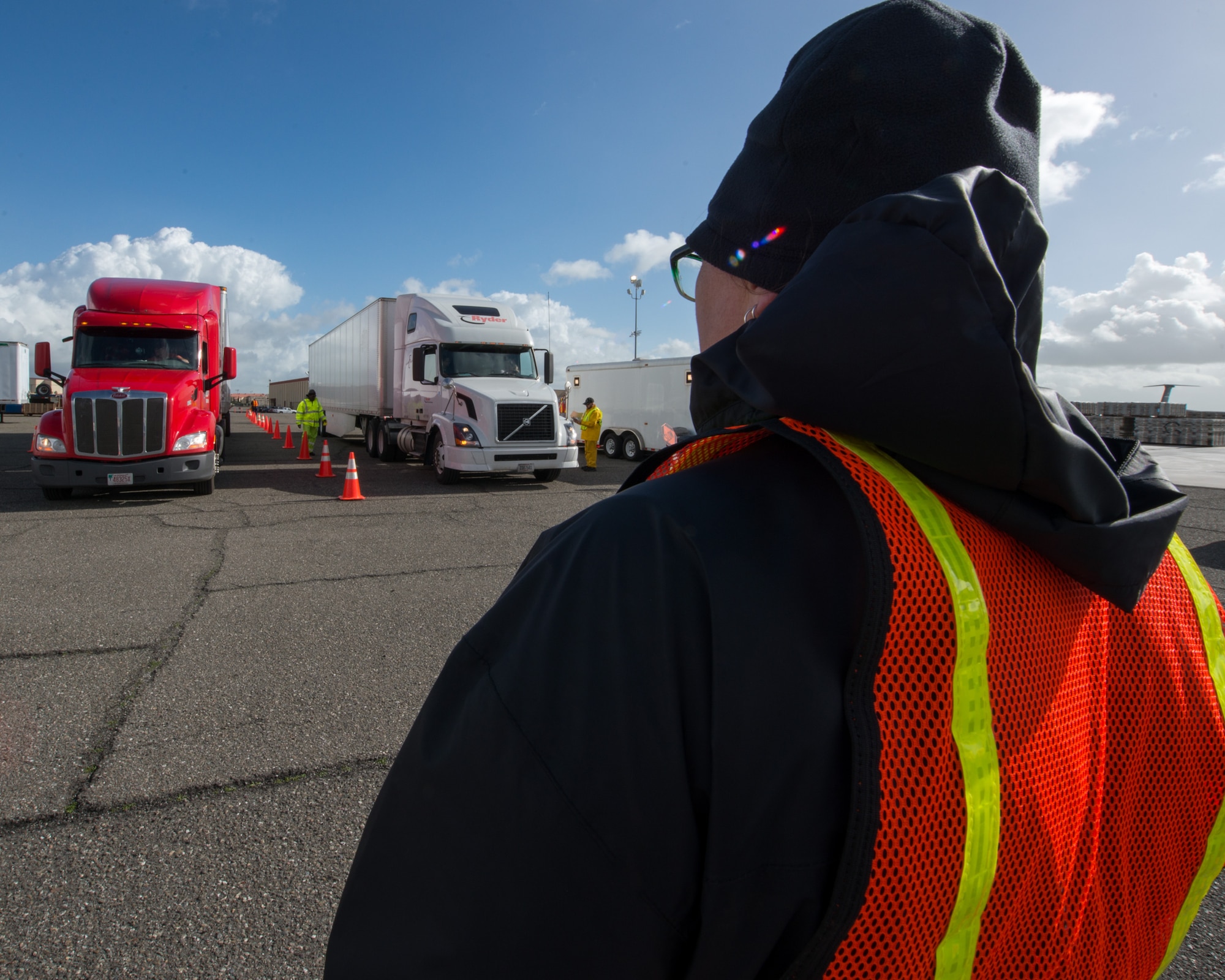 Trucks and personnel from the Federal Emergency Management Agency arrive at Travis Air Force Base, Calif., Feb. 16, 2017. Travis AFB is acting as a staging area for FEMA personnel, providing space for necessary equipment and supplies in case of the Oroville auxiliary spillway failure. (U.S. Air Force photo/Louis Briscese)