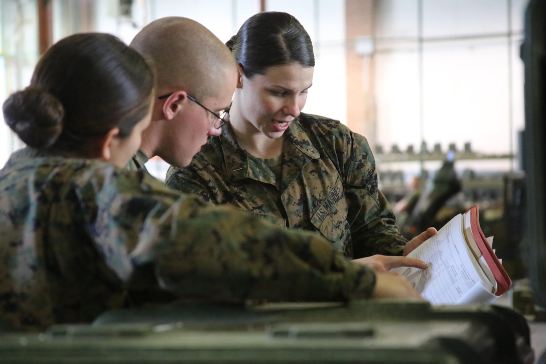 1st Lt. Morgan White, right, instructs her Marines during a squadron-wide gear inspection aboard Marine Corps Air Station Cherry Point, N.C., Feb. 6, 2017. White states that the training she has received in the Marine Corps helped develop her leadership and decision-making skills. “The Marine Corps teaches you to make hard decisions,” said White. “When life throws us questions that we don’t know the answer to, we’ve learned to quickly think on our feet.” White is the communications officer for Marine Wing Support Squadron 274, Marine Aircraft Group 14, 2nd Marine Aircraft Wing. (U.S. Marine Corps photo by Cpl. Mackenzie Gibson/Released)