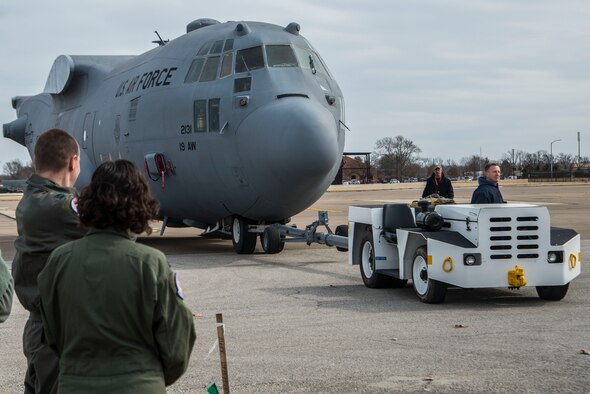 Contractors work with the 375th Aeromedical Evacuation Squadron to help move a C-130 fuselage trainer (Fut), Feb. 23, 2017 at Scott Air Force Base, Illinois. The FuT is a platform where aeromedical evacuation crews can perform 100 percent of readiness skills. It is an innovative, cost effective, improved training platform for total force AE crew members and ground support personnel in terms of aircraft configuration familiarization and realistic, high-fidelity task training and mission simulation. (U.S. Air Force photo/Senior Airman Tristin English)