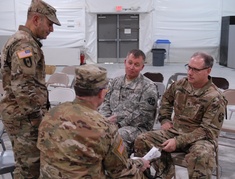 Capt. Dennis Consolver and Sgt. 1st Class John Cunningham, U.S. Army Reserve Soldiers with Army Reserve Medical Command’s 7227th Medical Support Unit, discuss a religious scenario with observer coach/trainers Lt. Col. Jose Nunez and Capt. Cecil Edwards.  The exercise inject will be used to test the 7227th commander’s response to his Soldier’s religious needs.  The scenarios placed on Soldiers within the 7227th are training and validation injects in preparation for the unit’s upcoming mobilization in support of Landstuhl Regional Medical Center’s Deployed Warrior Medical Management Center.  Soldiers assigned to the 7227th MSU, out of Columbia, Missouri, have been working alongside 1st Army Division West’s observer coach/trainers with 4th Battalion (Medical), 393rd Infantry Regiment in North Fort Hood for three weeks in preparation for their upcoming mission.