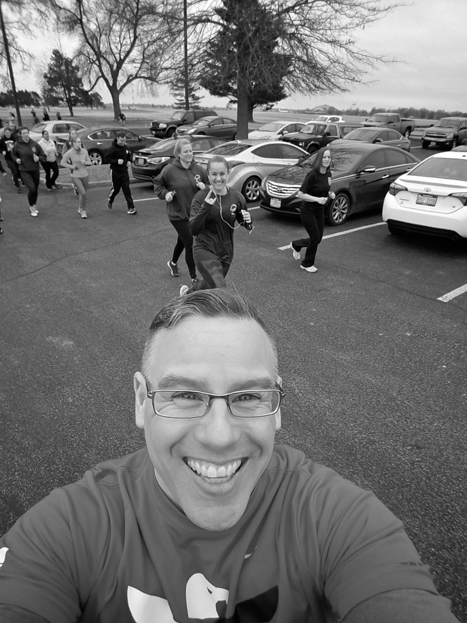 Christopher Parr, 932nd Airlift Wing Public Affairs specialist snaps a quick photo, during the warm up laps, before starting the Monday workout for the running clinic, Feb. 6, 2017, Scott Air Force Base, Illinois.  You can follow along with Parr's adventures in running by checking out his weekly blog in the commentaries section.  (U.S. Air Force photo by Christopher Parr)