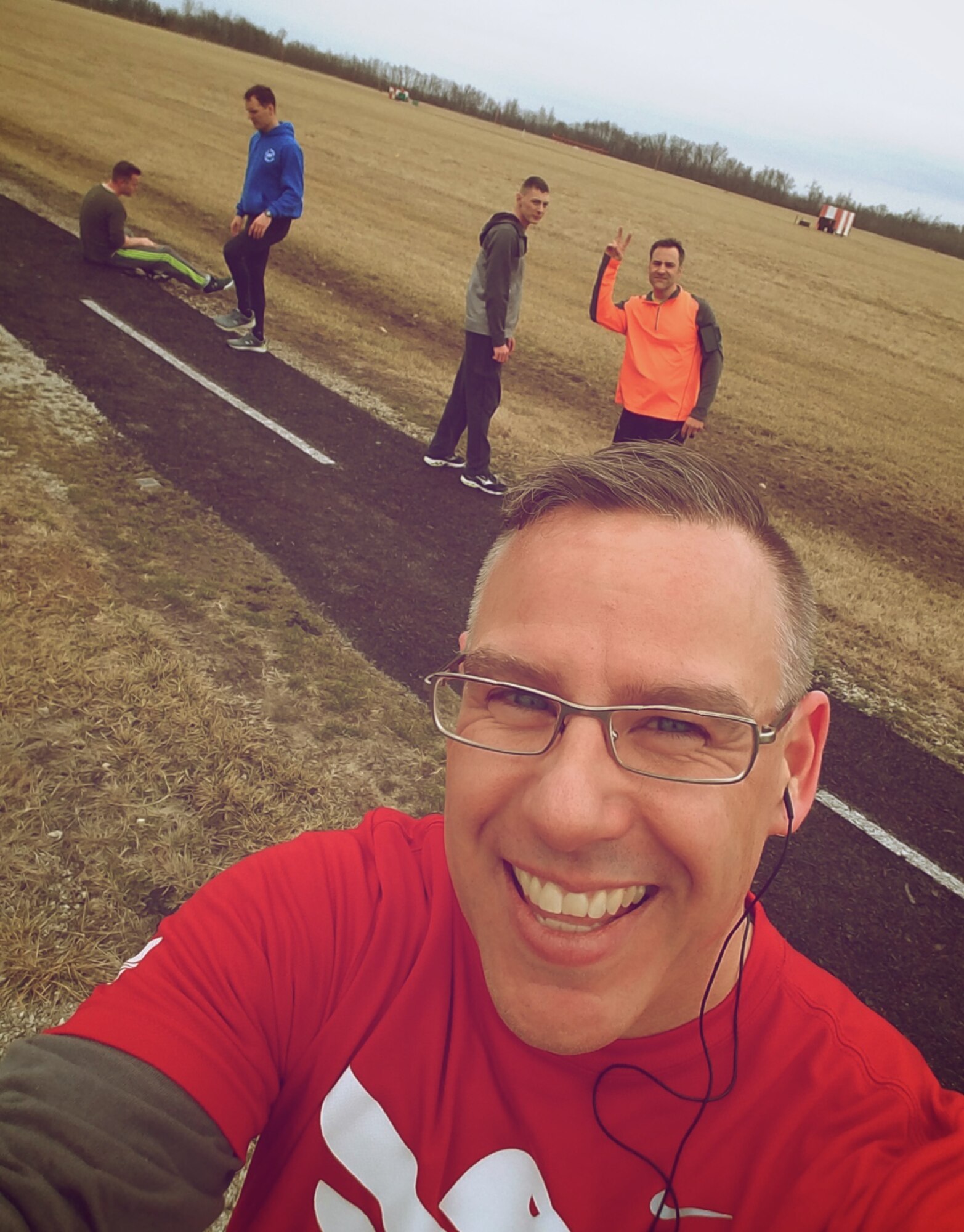 Christopher Parr, 932nd Airlift Wing Public Affairs specialist is photobombed by Lt. Col. Troy Appel, commander, 932nd Aircraft Maintenance Squadron, Feb. 6, 2017, Scott Air Force Base, Illinois.  Parr is documenting his participation in the Scott Health Promotion's Running Clinic.  You see is weekly blog in the commentaries section of the 932nd AW website.  (U.S. Air Force photo by Christopher Parr)