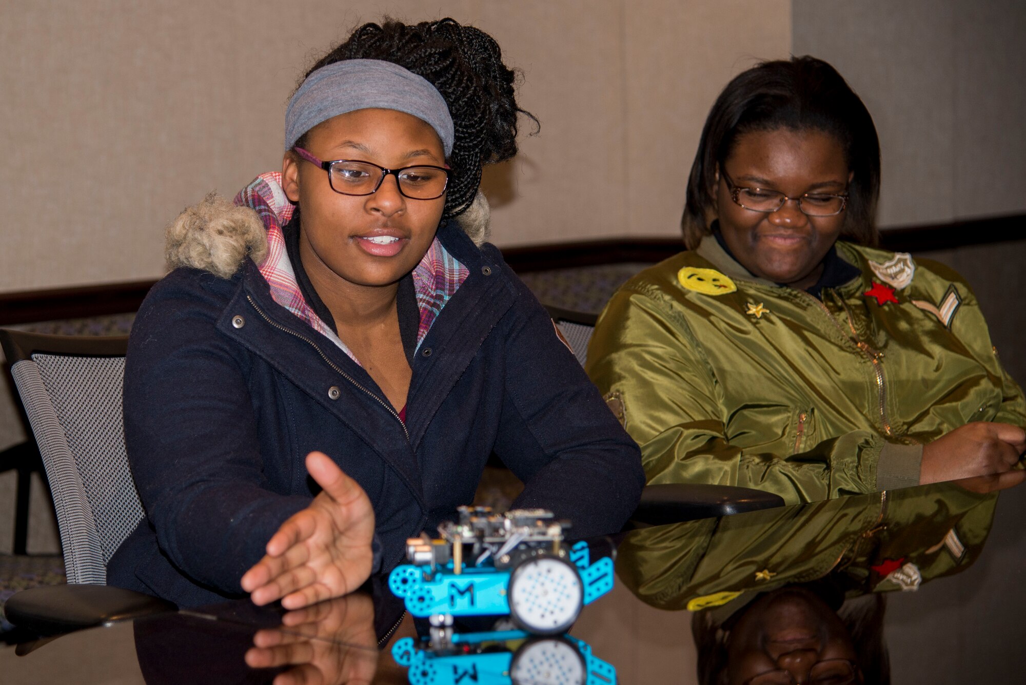 Students from the Cyber Patriot program participate in a demonstration Feb. 16 at the Airt Force Network Integration Center building. The students were shown what type of things electronics could be programmed to do as part of their visit to learn about the cyber career field. (U.S. Air Force photo by Airman Chad Gorecki)