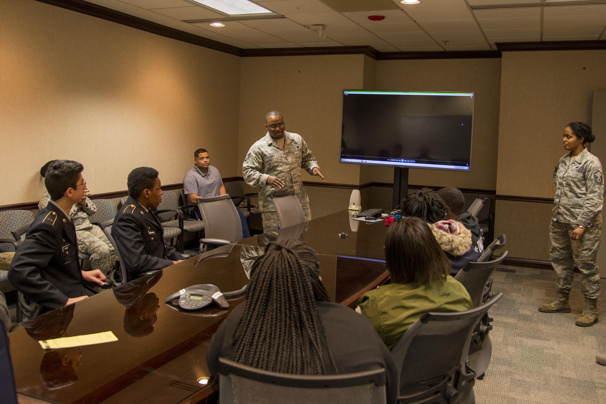 Students from the Cyber Patriot Program listen during a breifing by a cyber professional Feb. 16 at the Air Force Network Integration Center building at Scott Air Force Base, IL. The students were given information from cyber professionals to interest them in a career in the cyber field. (U.S. Air Force phot by Airman Chad Gorecki)