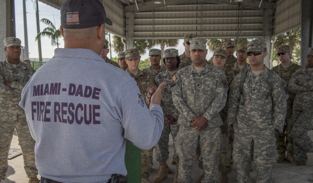 Lt. Al Tonanez, Miami-Dade Fire Rescue training officer, briefs soldiers from the 329th Chemical Company and the 469th Medical Company on secure hazardous material during training on Miami-Dade Fire Rescue headquarters, Miami, Fl. Feb 17, 2016. These training events were held by fire rescue personnel in preparation for a validation exercise held by U.S. Army North and U.S. Northern Command. 
