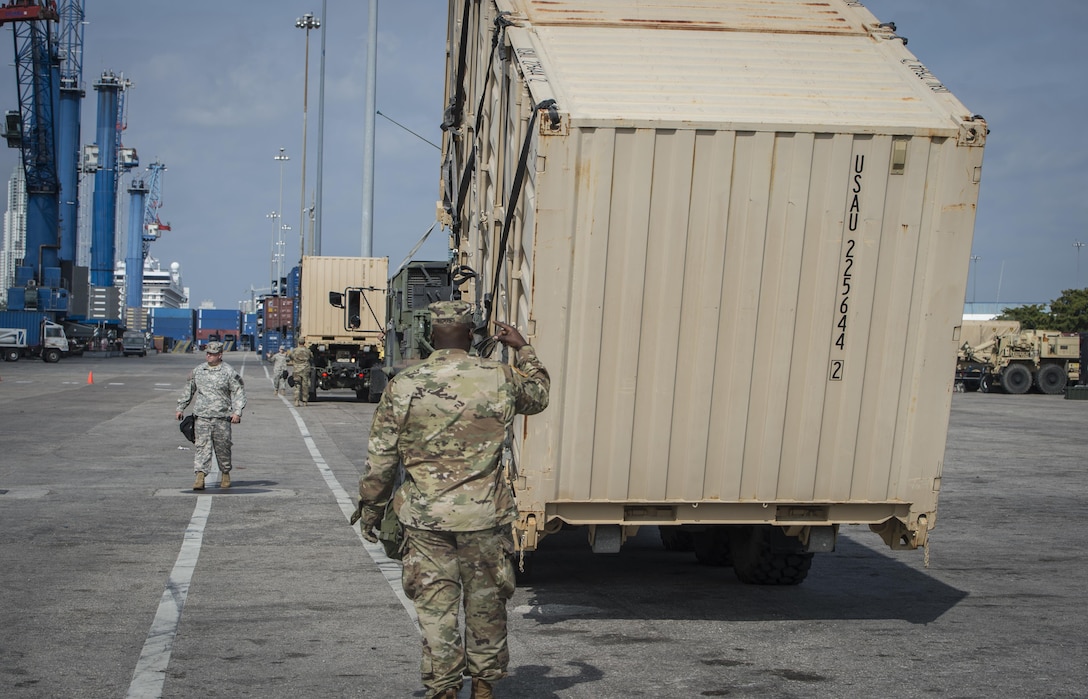 U.S. Army Reserve Soldiers from the 329th Chemical Company off-load equipment during a hazardous material exercise at the Port of Miami, Fla. Feb 18, 2017. The exercise was led by Miami-Dade Fire Rescue and U.S. Army North under the supervision of U.S. Northern Command and provided soldiers and first responders the unique experience of operating together in a major metropolitan city. 
