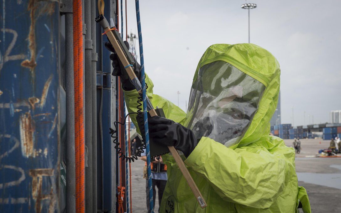 U.S. Army Reserve Spc. Caroline Reams, 329th Chemical Company chemical biological warfare specialist, scans a shipping container for possible contamination during a hazardous material decontamination exercise on the Port of Miami, Fla. Feb 18, 2017.The exercise was led by Miami-Dade Fire Rescue and U.S. Army North under the supervision of U.S. Northern Command and provided soldiers and first responders the unique experience of operating together in a major metropolitan city. 