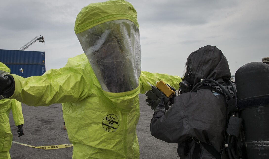 Cpl. Shalandis Johnson (right), 329th Chemical Company chemical biological warfare specialist, prepares Spc. Jamie Alamos, 329th Chemical Company chemical biological warfare specialist, decontamination during a hazardous material decontamination exercise on the Port of Miami, Fla. Feb 18, 2017.The exercise was led by Miami-Dade Fire Rescue and U.S. Army North under the supervision of U.S. Northern Command and provided soldiers and first responders the unique experience of operating together in a major metropolitan city. 