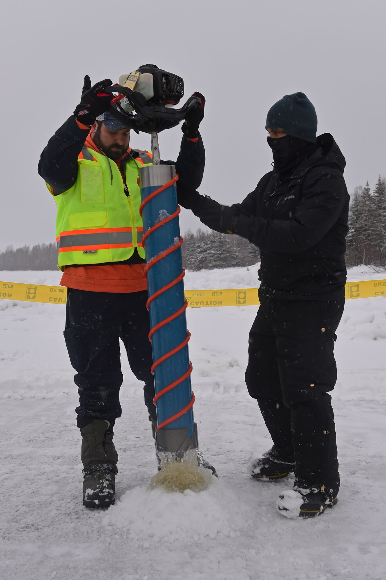 Members of the 611th Civil Engineer Squadron, U.S. Navy Supervisor of Salvage, U.S. Coast Guard, Alaska Department of Environmental Conservation, and the U.S. Environmental Protection Agency, participate in an arctic response training exercise at Sixmile Lake at Joint Base Elmendorf-Richardson, Alaska, Feb. 15, 2017. The training involved learning oil-spill response techniques on the ice and crisis response methods during arctic conditions. 