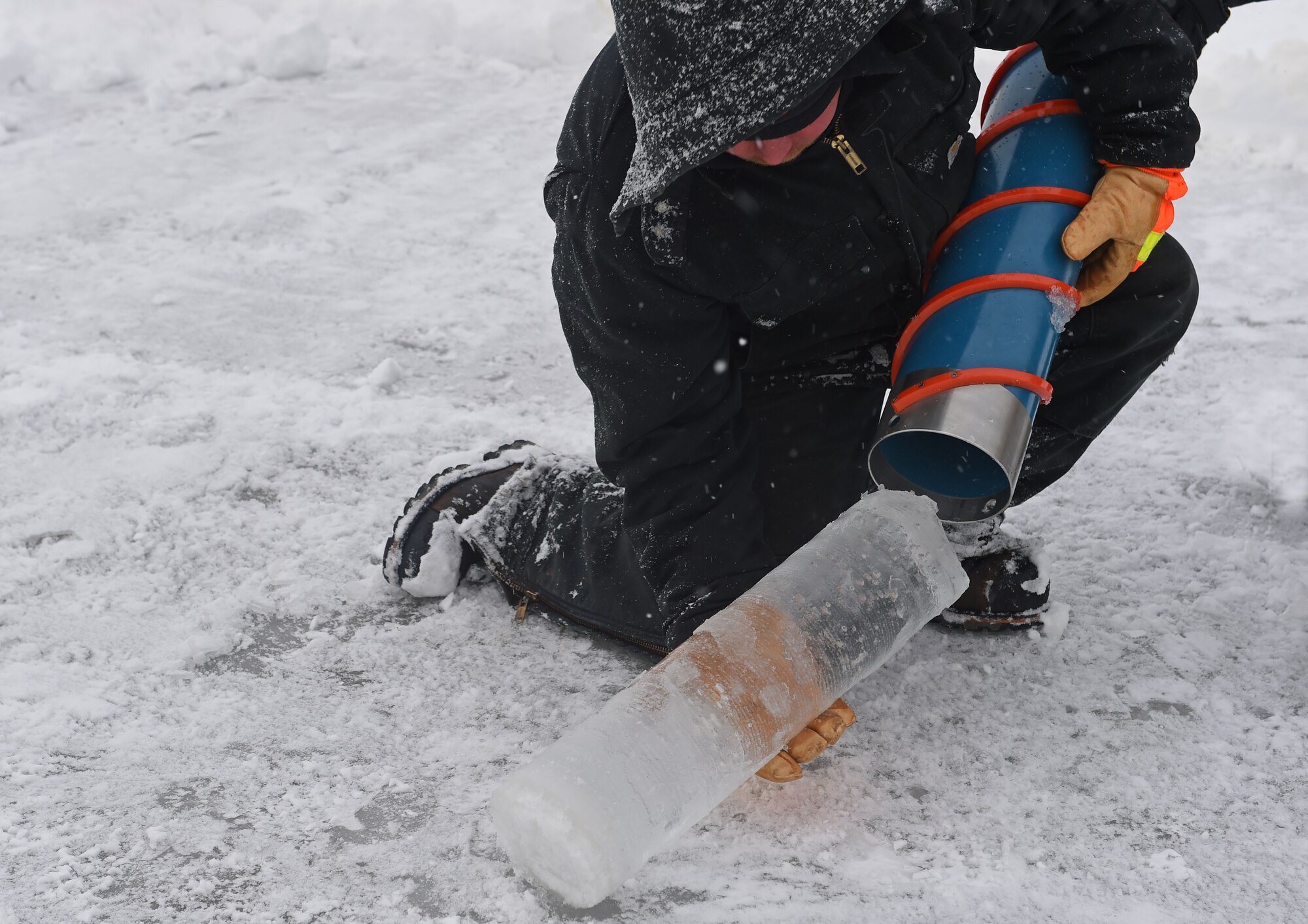 Members of the 611th Civil Engineer Squadron, U.S. Navy Supervisor of Salvage, U.S. Coast Guard, Alaska Department of Environmental Conservation, and the U.S. Environmental Protection Agency, participate in an arctic response training exercise at Sixmile Lake at Joint Base Elmendorf-Richardson, Alaska, Feb. 15, 2017. The training involved learning oil-spill response techniques on the ice and crisis response methods during arctic conditions. 
