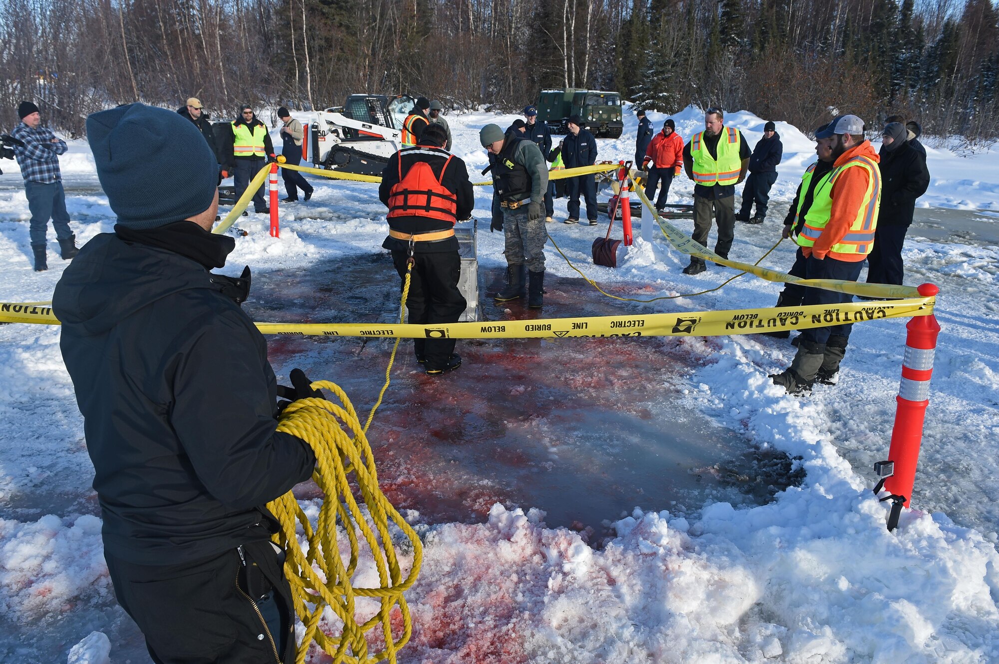 Members of the 611th Civil Engineer Squadron, U.S. Navy Supervisor of Salvage, U.S. Coast Guard, Alaska Department of Environmental Conservation, and the U.S. Environmental Protection Agency, participate in an arctic response training exercise at Sixmile Lake at Joint Base Elmendorf-Richardson, Alaska, Feb. 15, 2017. The training involved learning oil-spill response techniques on the ice and crisis response methods during arctic conditions. 