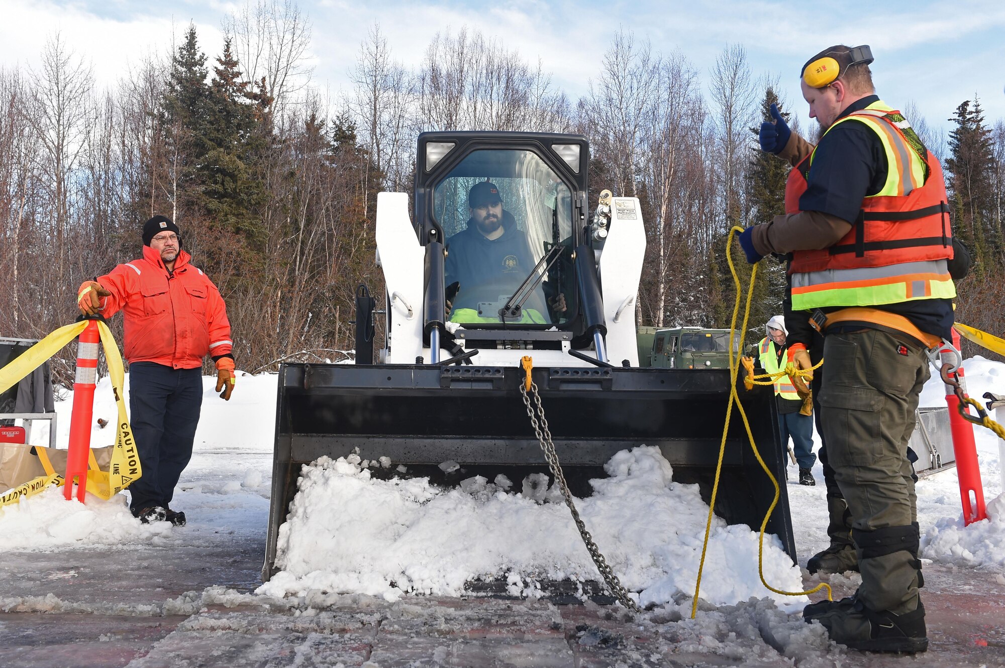 Members of the 611th Civil Engineer Squadron, U.S. Navy Supervisor of Salvage, U.S. Coast Guard, Alaska Department of Environmental Conservation, and the U.S. Environmental Protection Agency, participate in an arctic response training exercise at Sixmile Lake at Joint Base Elmendorf-Richardson, Alaska, Feb. 15, 2017. The training involved learning oil-spill response techniques on the ice and crisis response methods during arctic conditions. 