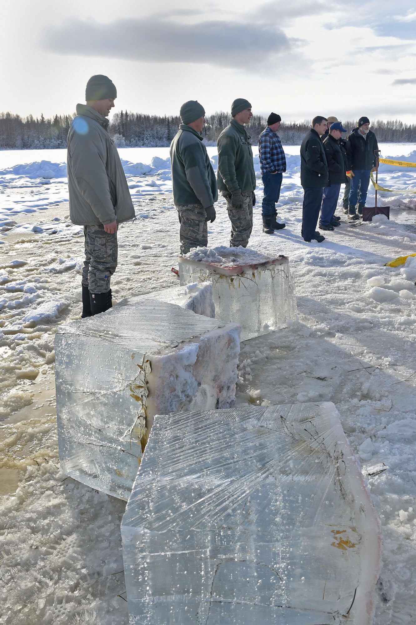 Members of the 611th Civil Engineer Squadron, U.S. Navy Supervisor of Salvage, U.S. Coast Guard, Alaska Department of Environmental Conservation, and the U.S. Environmental Protection Agency, participate in an arctic response training exercise at Sixmile Lake at Joint Base Elmendorf-Richardson, Alaska, Feb. 15, 2017. The training involved learning oil-spill response techniques on the ice and crisis response methods during arctic conditions. 