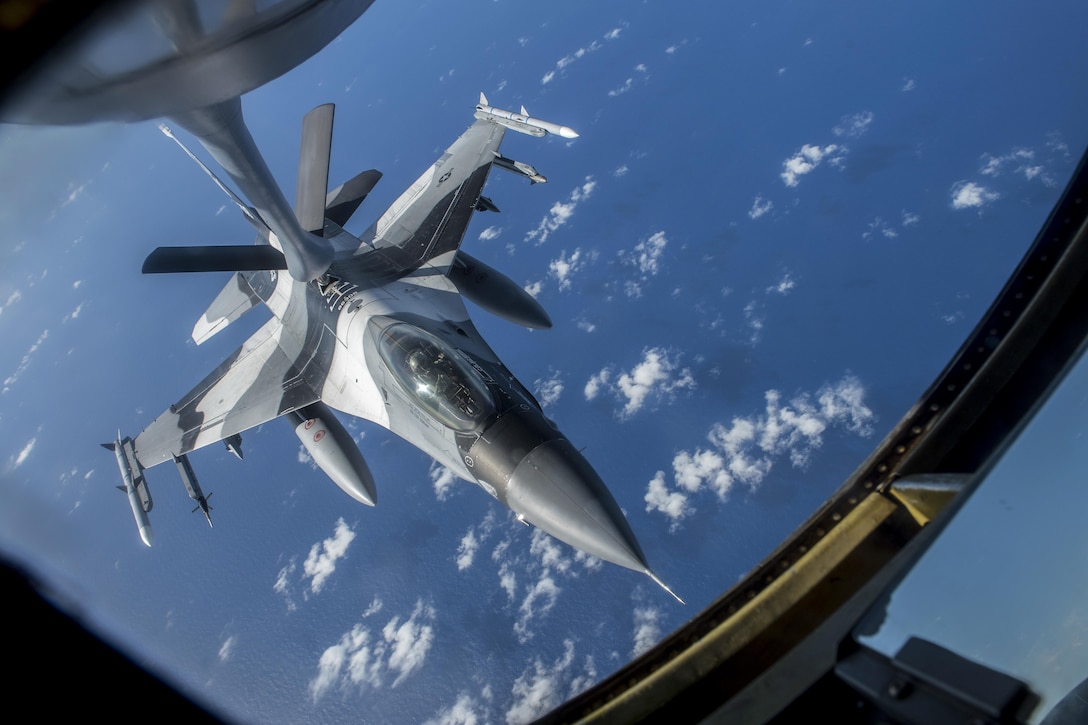 An Air Force F-16 Fighting Falcon receives fuel from a 909th Air Refueling Squadron KC-135 Stratotanker off the coast of Guam, Feb. 21, 2017. The aircraft is assigned to the 18th Aggressor Squadron. Both aircraft units and U.S. Pacific Command units are training with Japanese and Australian forces to participate in the exercise Cope North. Air Force photo by Senior Airman John Linzmeier