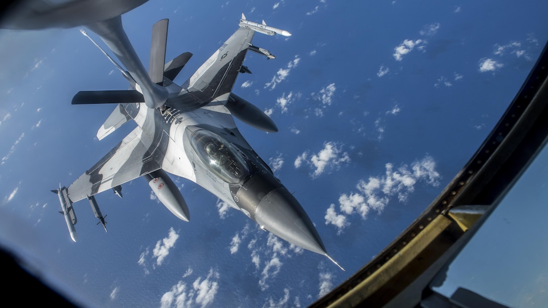 An Air Force F-16 Fighting Falcon receives fuel from a 909th Air Refueling Squadron KC-135 Stratotanker off the coast of Guam, Feb. 21, 2017. The aircraft is assigned to the 18th Aggressor Squadron. Both aircraft units and U.S. Pacific Command units are training with Japanese and Australian forces to participate in the exercise Cope North. Air Force photo by Senior Airman John Linzmeier