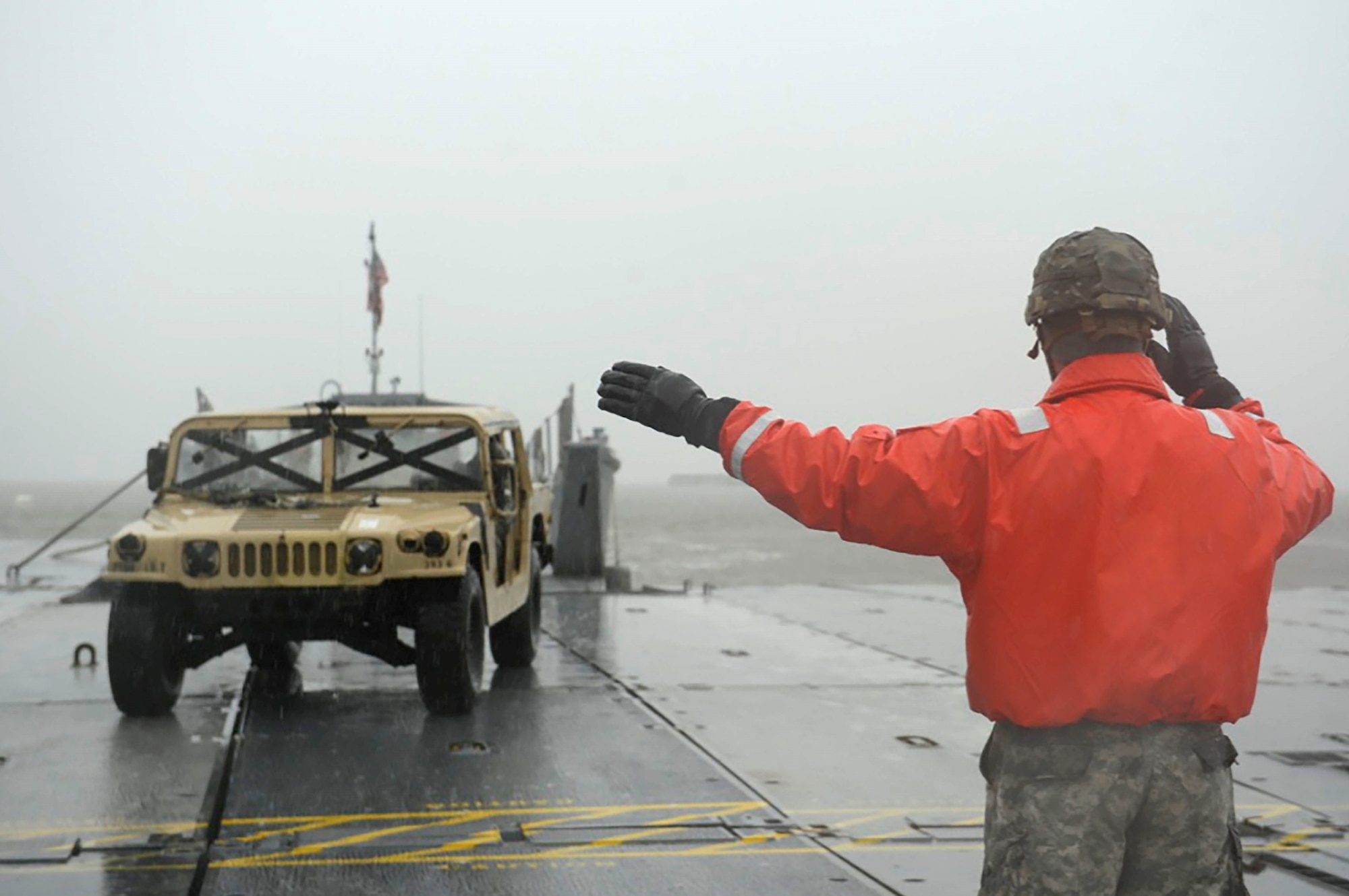 A U.S. Army CH-47 Chinook helicopter transports vehicles to a floating causeway on the James River as part of a sling-load operations exercise at Joint Base Langley-Eustis, Va., Feb. 15, 2017. The field training exercise involved Soldiers from the 331st Transportation Company, 11th Battalion, 7th Transportation Brigade (Expeditionary) working with land, sea and air components to prepare for real-world scenarios such as humanitarian relief or global disasters. (U.S. Air Force photo by Airman 1st Class Kaylee Dubois)