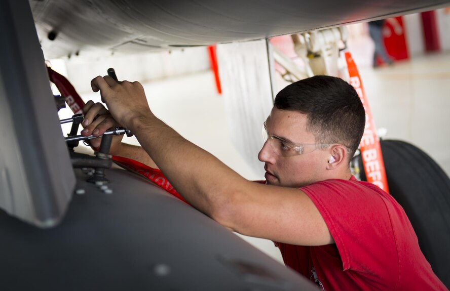 Senior Airman Nicholas Brooks, 96th Aircraft Maintenance Squadron Red Crew, tightens a bolt on the F-15 Eagle Feb. 17 at Eglin Air Force Base, Fla. The 30-minute competition tests the knowledge and proficiency of the crews. The annual competition also identifies the load crew of the year and earns them bragging rights as the best of 22. The winning crew is scheduled to be announced at the Maintenance Professionals of the Year Banquet in March. (U.S. Air Force photo/Kristin Stewart)