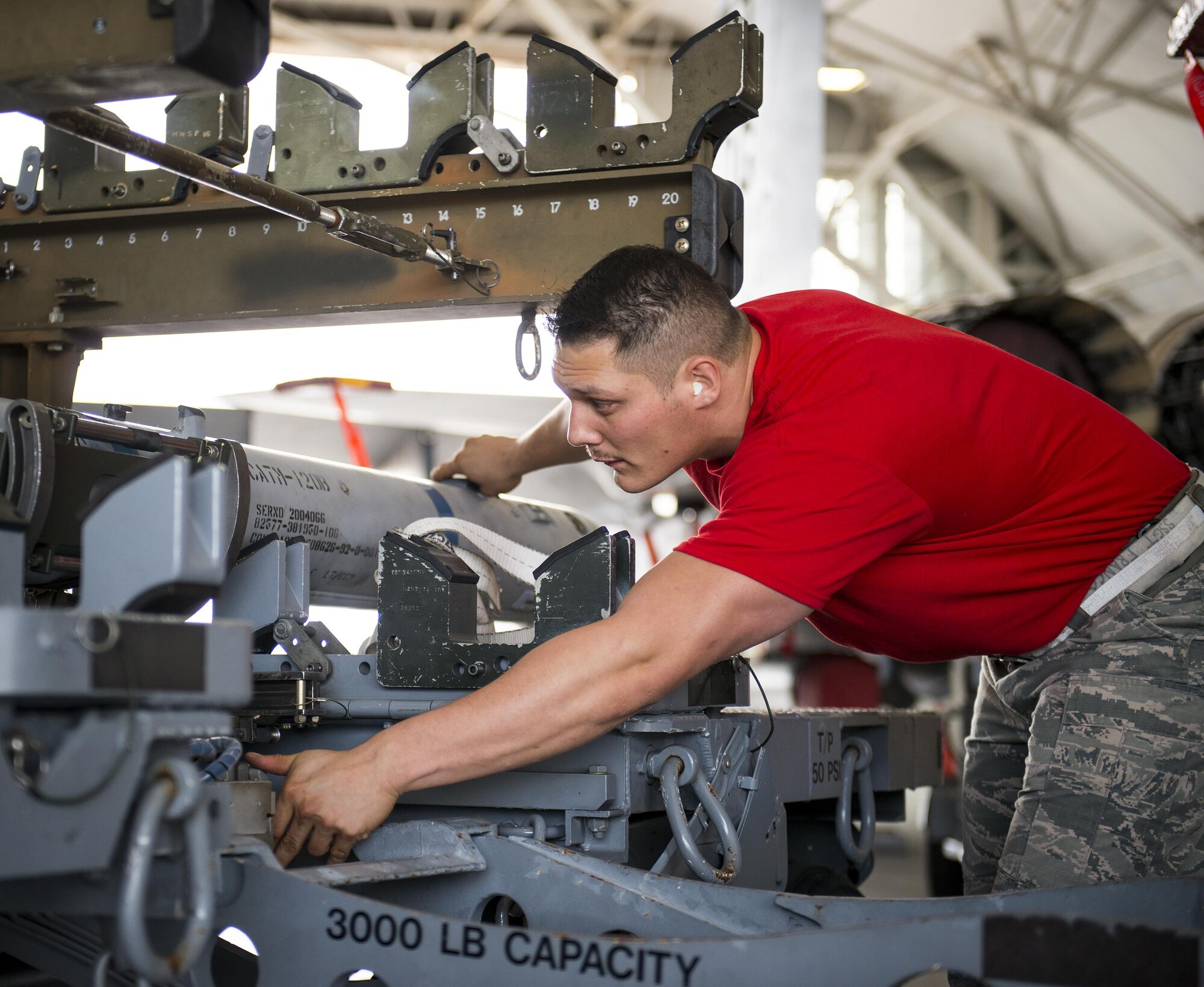 Staff Sgt. Vincent Franco, 96th Aircraft Maintenance Squadron Red Crew, ensures the AIM-120 is properly loaded onto the MJ-1 Bomb Lift Truck before it’s attached to the wing of an F-15 Eagle Feb. 17 at Eglin Air Force Base, Fla. The 30-minute competition tests the knowledge and proficiency of the crews. The annual competition also identifies the load crew of the year and earns them bragging rights as the best of 22. The winning crew is scheduled to be announced at the Maintenance Professionals of the Year Banquet in March. (U.S. Air Force photo/Kristin Stewart)
