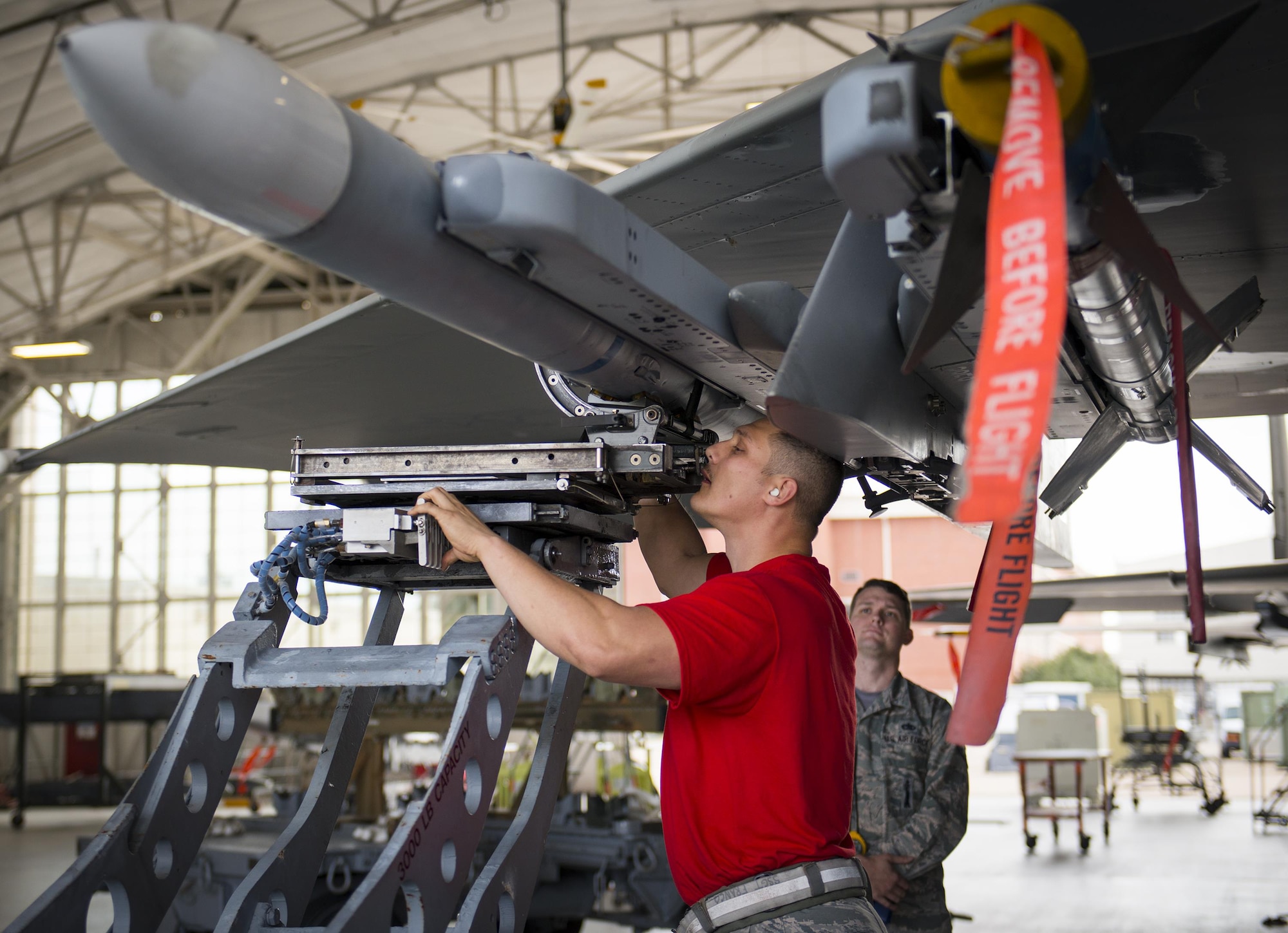 Staff Sgt. Vincent Franco, 96th Aircraft Maintenance Squadron Red Crew, uses the MJ-1 Bomb Lift Truck to line up the AIM-120 onto the F-15 Eagle munition rail Feb. 17 at Eglin Air Force Base, Fla. The 30-minute competition tests the knowledge and proficiency of the crews. The annual competition also identifies the load crew of the year and earns them bragging rights as the best of 22. The winning crew is scheduled to be announced at the Maintenance Professionals of the Year Banquet in March. (U.S. Air Force photo/Kristin Stewart)