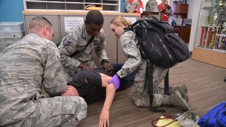 Medics from the 377 Medical Group tend to a patient during an active shooter exercise at the medical group clinic Feb. 21.  (U.S. Air Force Photo/Senior Airman Chandler Baker)