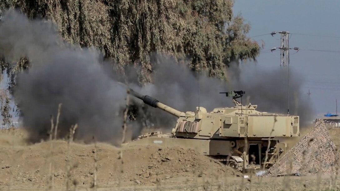 Soldiers fire an M109A6 Paladin from a tactical assembly area at Hamam al-Alil to support the start of the Iraqi security forces' offensive in West Mosul, Iraq, Feb. 19, 2017. More than 60 coalition partners have committed themselves to the goal of eliminating the threat posed by the Islamic State of Iraq and Syria. The soldiers are assigned to the 1st Cavalry Division's 2nd Battalion, 82nd Field Artillery Regiment, 3rd Armored Brigade Combat Team. Army photo by Staff Sgt. Jason Hull