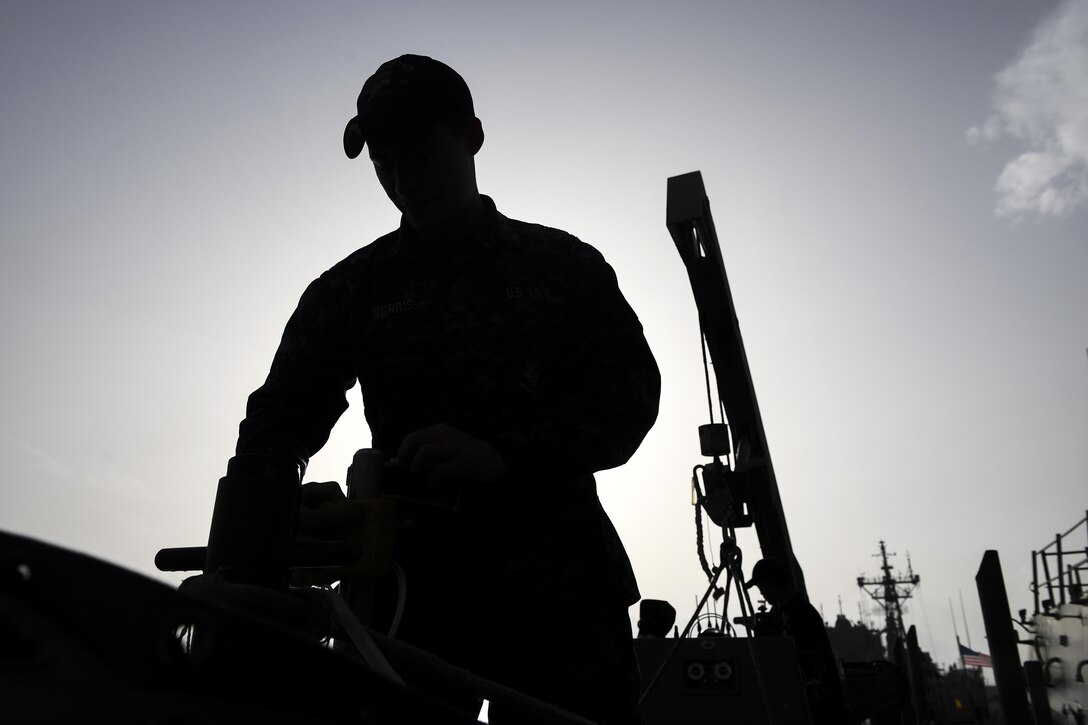 Navy Seaman Hunter Norris performs preventive maintenance on an inflatable boat on the USS Porter at Naval Station Rota, Spain, Feb. 21, 2017. The Porter is conducting operations in the U.S. 6th Fleet area of operations to support U.S. national security interests in Europe. Navy photo by Petty Officer 3rd Class Ford Williams