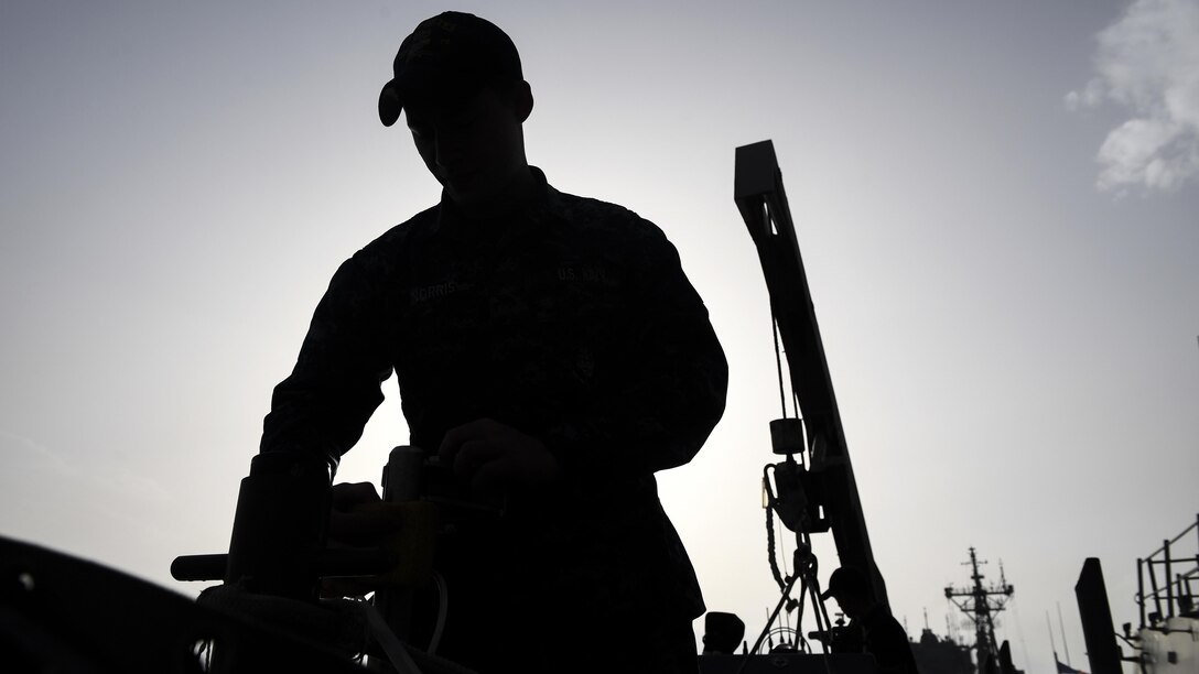 Navy Seaman Hunter Norris performs preventive maintenance on an inflatable boat on the USS Porter at Naval Station Rota, Spain, Feb. 21, 2017. The Porter is conducting operations in the U.S. 6th Fleet area of operations to support U.S. national security interests in Europe. Navy photo by Petty Officer 3rd Class Ford Williams