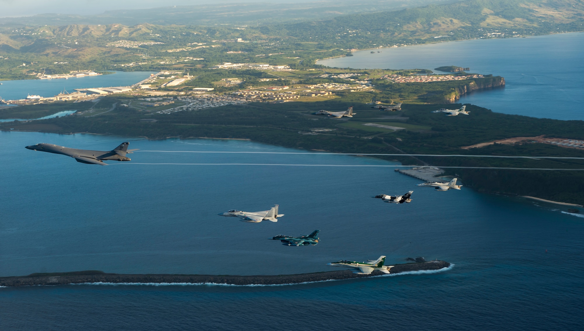 Aircraft from the United States, Japanese and Australian air forces fly in formation during exercise Cope North 2017 off the coast of Guam, Feb. 21, 2017. The exercise includes 22 total flying units and more than 2,700 personnel from three countries and continues the growth of strong, interoperable relationships within the Indo-Asia Pacific Region through integration of airborne and land-based command and control assets. (U.S. Air Force Photo by Staff Sgt. Aaron Richardson)