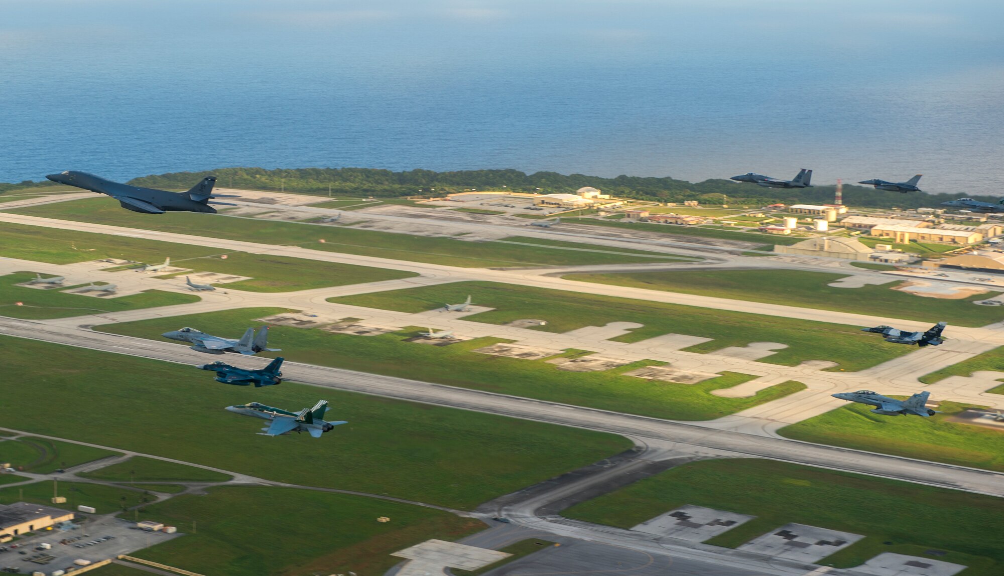 Aircraft from the United States, Japanese and Australian air forces fly in formation during exercise Cope North 2017 off the coast of Guam, Feb. 21, 2017. The exercise includes 22 total flying units and more than 2,700 personnel from three countries and continues the growth of strong, interoperable relationships within the Indo-Asia Pacific Region through integration of airborne and land-based command and control assets. (U.S. Air Force Photo by Staff Sgt. Aaron Richardson)