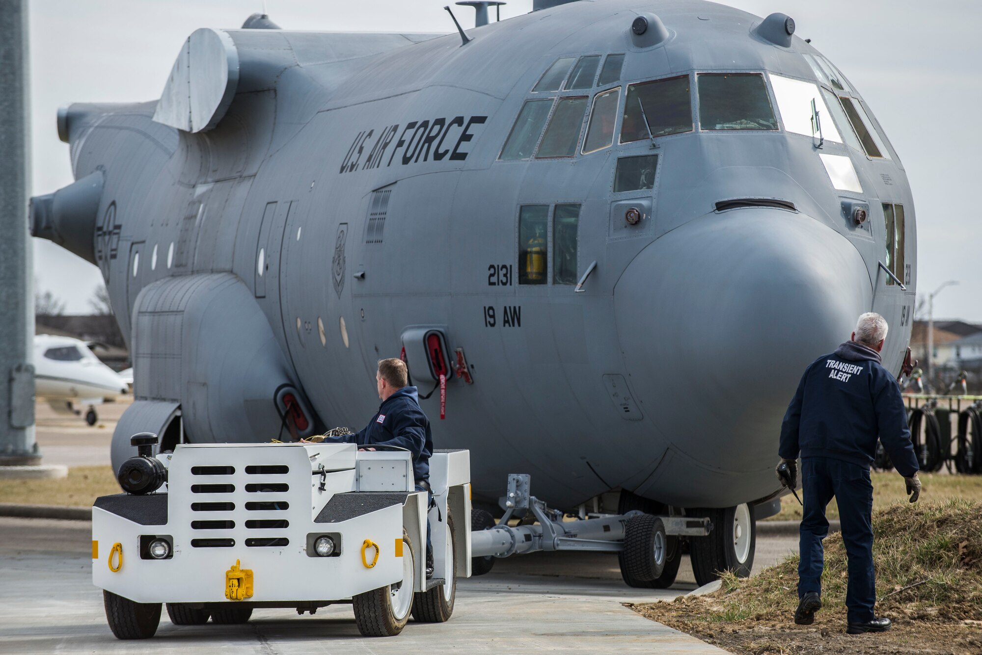 Contractors work with the 375th Aeromedical Evacuation Squadron to help move a C-130 fuselage trainer at Scott Air Force Base, Ill., Feb. 23, 2017. The FuT allows for hands-on muscle memory of configuration, placement of in-flight kits, electrical, oxygen, emergency exits, and various other operations. One hundred percent of readiness skills are completed for the aeromedical evacuation technicians. It helps provide an innovative, cost effective, improved training platform for total force AE crew members and ground support personnel in terms of aircraft configuration familiarization and realistic, high-fidelity task training and mission simulation. (U.S. Air Force photo by Senior Airman Tristin English)