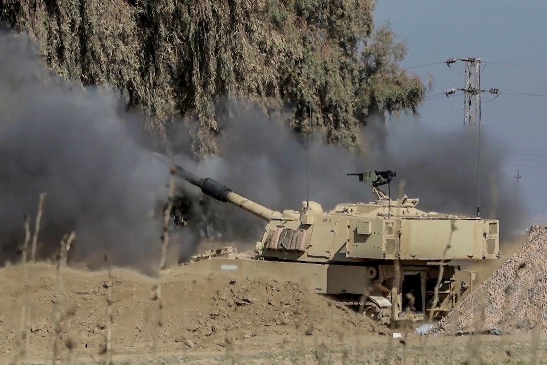 Soldiers fire an M109A6 Paladin from a tactical assembly area at Hamam al-Alil to support the start of the Iraqi security forces' offensive in West Mosul, Iraq, Feb. 19, 2017. More than 60 coalition partners have committed themselves to the goal of eliminating the threat posed by the Islamic State of Iraq and Syria. The soldiers are assigned to the 1st Cavalry Division's 2nd Battalion, 82nd Field Artillery Regiment, 3rd Armored Brigade Combat Team. Army photo by Staff Sgt. Jason Hull