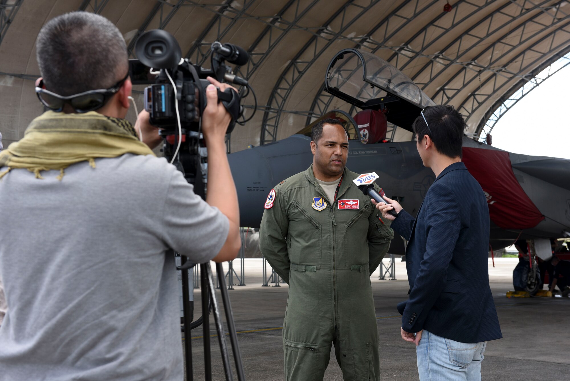 U.S. Air Force Maj. Marc Morris, 67th Fighter Squadron F-15 Eagle pilot, speaks to media Feb. 22, 2017, at Andersen Air Force Base, Guam. A flightline tour was conducted as an opportunity for reporters to observe operations of annual exercise Cope North. Squadrons from various U.S., Australian and Japanese air force units provided aircraft static displays to reporters, demonstrating their level of commitment and posture to protect and stabilize the Indo-Asia Pacific. Participants from Kadena Air Base included the 909th Air Refueling Squadron and 961st Airborne Air Control Squadron. (U.S. Air Force photo by Senior Airman John Linzmeier)